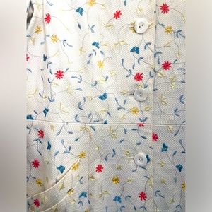 Worth Collection. 3/4 length embroidered jacket . Embroidered on white pique.
